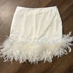 12th tribe white feathered skirt. Never worn